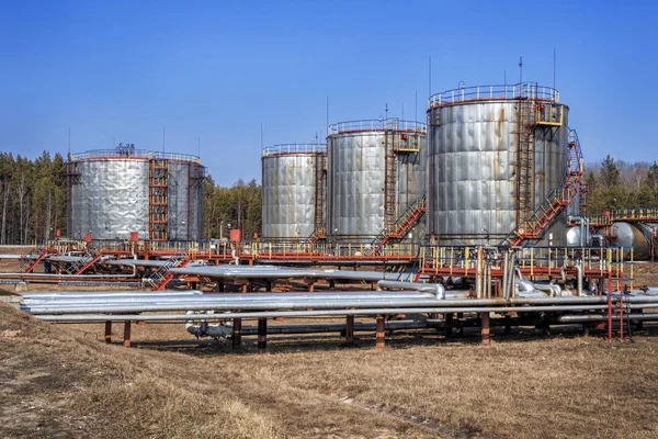 Large oil tank with valves and pipings — Stock Photo, Image