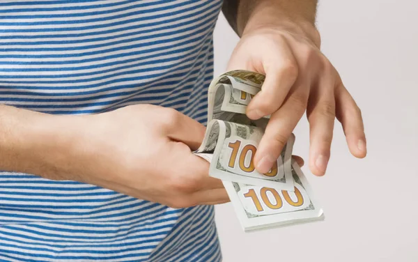 man holding money in hand