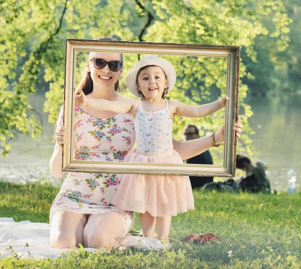 Pretty mother posing with her beloced child Stock Picture