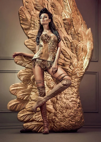 Golden sensual lady with giant wings Royalty Free Stock Images