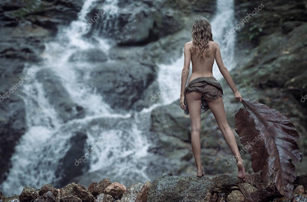 Anonymous Naked Girl In Tropical River With Waterfall By Nick Bondarev