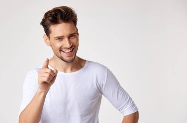 Handsome young man pointing something clipart