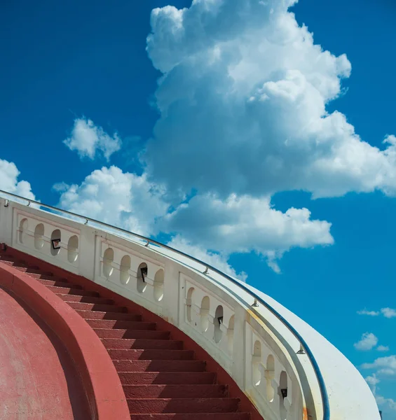 Stairs towards blue sky with clouds — Stock Photo, Image