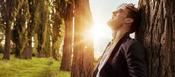 Handsome businessman enjoying the summer journey — Stock Photo, Image