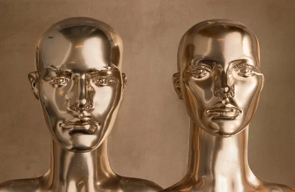 Two pieces of human golden scupltures — Stock Photo, Image