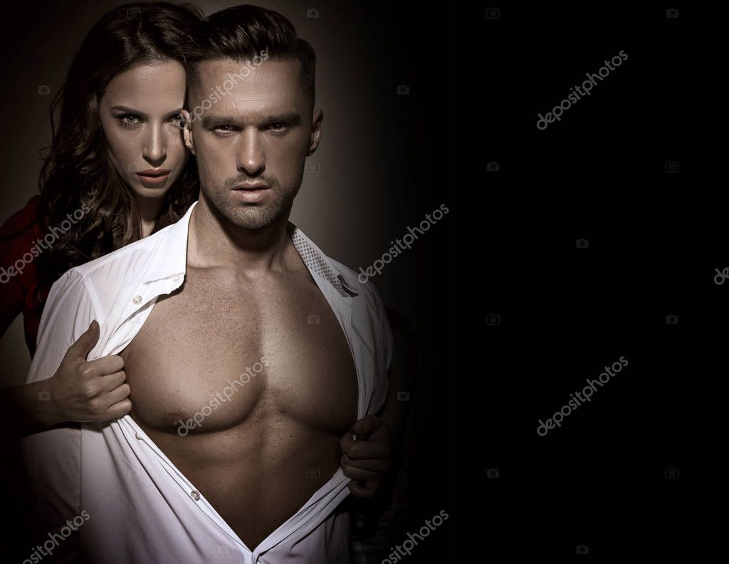 Woman touching mans chest