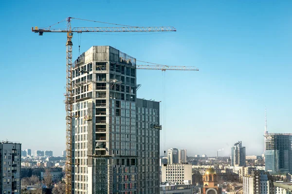 Cranes and housing estate Stock Image
