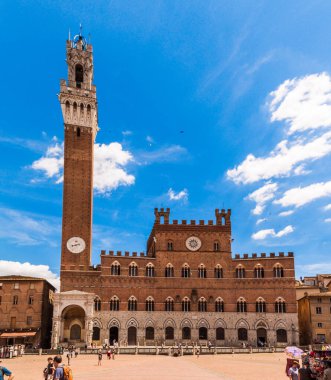 Siena / Italy - 23 June 2015: Palazzo Pubblico (Town Hall) in Siena (Tuscany, Italy) on a bright blue sky.