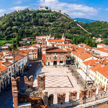 Marostica, Italy - Oktober, 01, 2017: View of the old building, chess square and castle on the mountain.