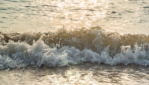 Sea surf with sunset light — Stock Photo, Image