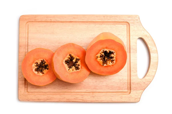 Papaya segment met houten blok geïsoleerd op witte achtergrond — Stockfoto