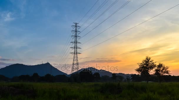 4K Time lapse of silhouette electricity pole with sunset sky and hill background — Stock Video