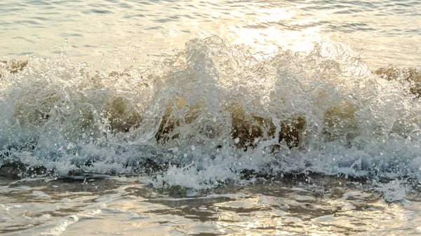 Sea surf with sunset light — Stock Photo, Image