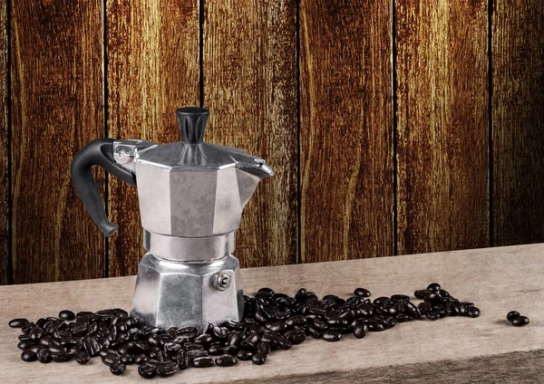 Coffee pot still life on wooden table with wooden wall — Stock Photo, Image