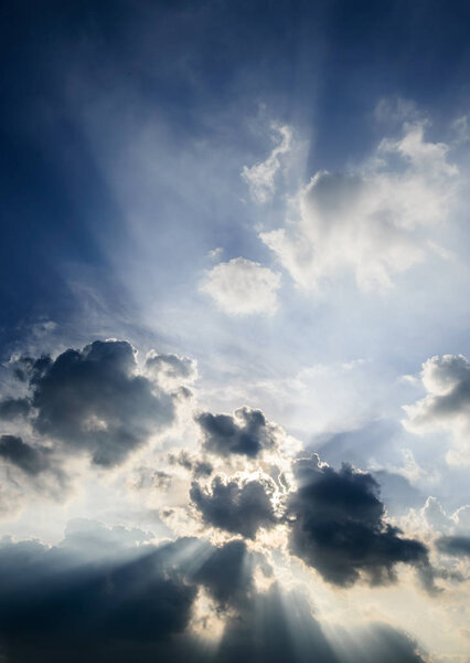 Dramatic sky, Sun ray shine with clouds in blue sky background