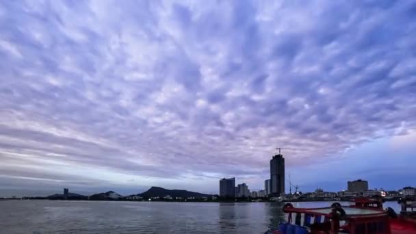 4K Time lapse of clouds movement at sea with cityscape background — Stock Video