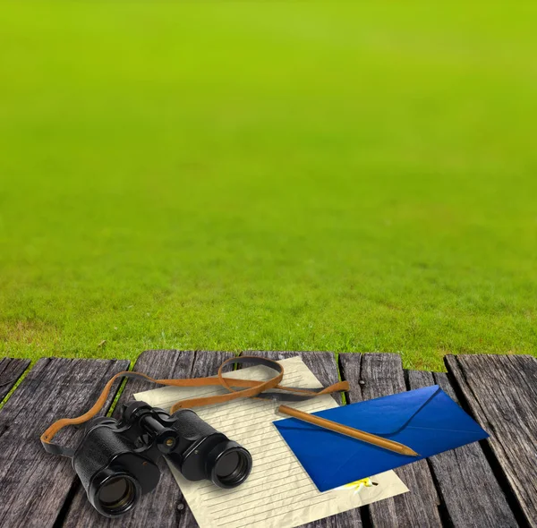 Binocular and letter on table, Adventure concept — Stock Photo, Image