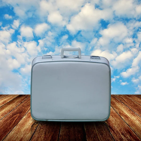 Vintage travel bag on wooden deck — Stock Photo, Image