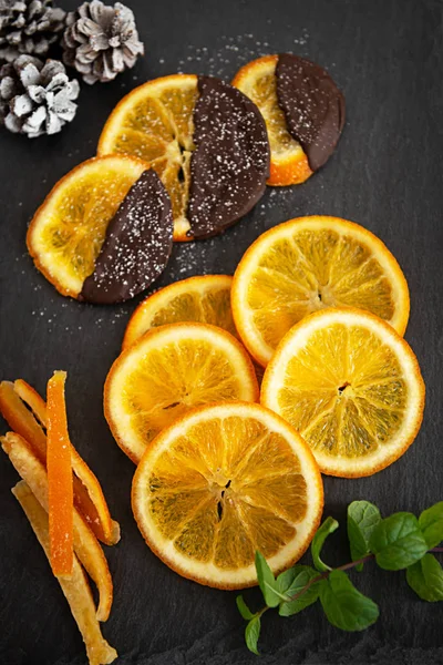 Candied orange in chocolate or sugar is a favorite Christmas treat for children and adults — Stock Photo, Image