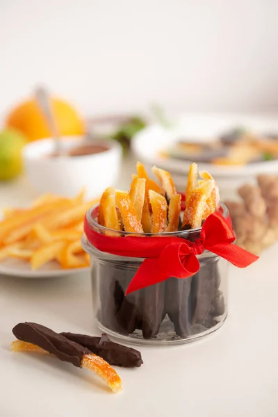 Image of homemade candied orange peel some pieces dipped in chocolate Stock Picture