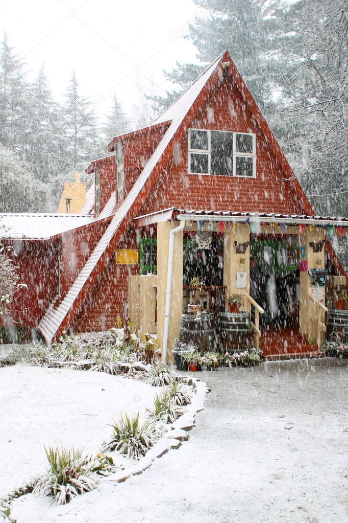 Quaint cottage during the snow
