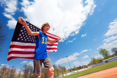 Teenage boy with flag of USA clipart