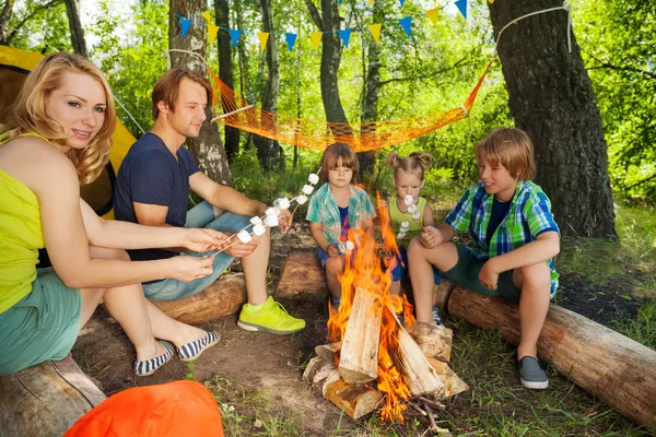 Young active family camping in forest — Stock Photo, Image