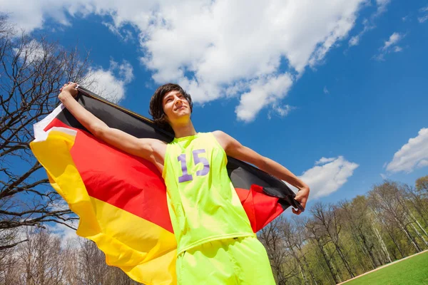 Sportovec, mávali Německá vlajka — Stock fotografie