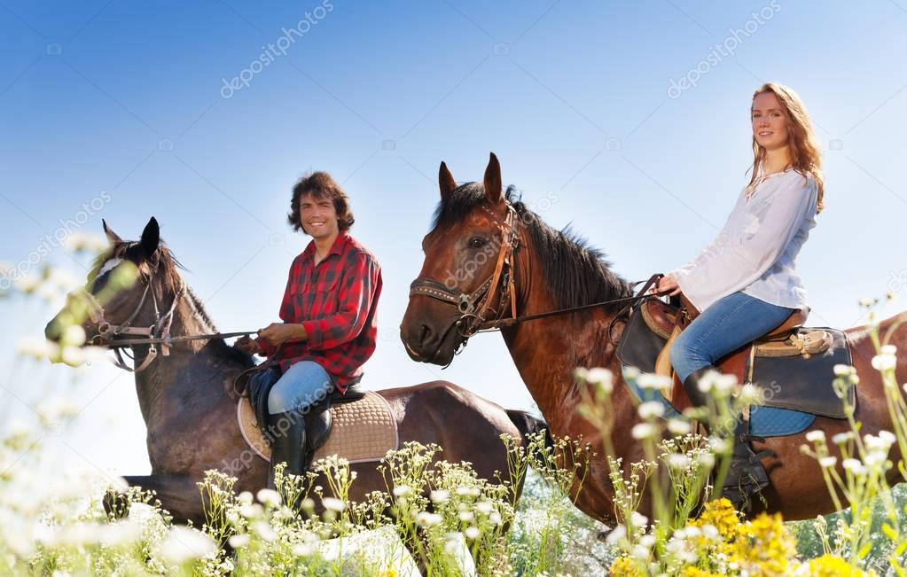 couple horseback riding
