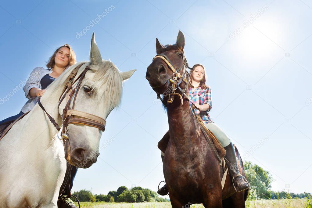 women riding horses