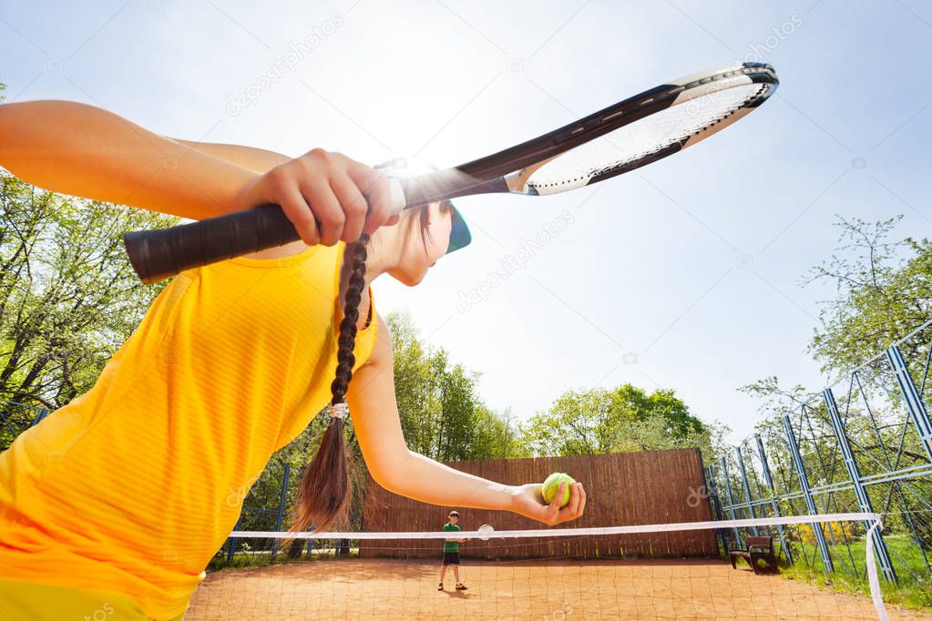 tennis player against blue sky