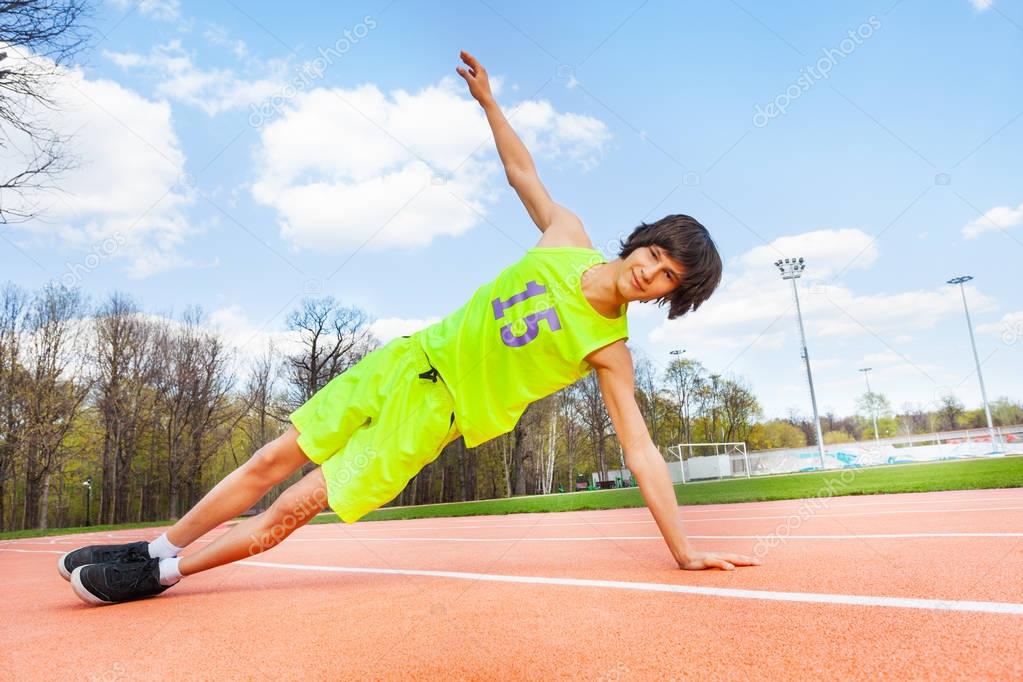 boy holding side plank