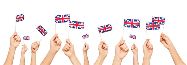 Hands holding flags of Great Britain — Stock Photo, Image