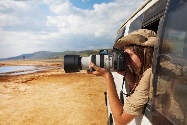 woman taking photo of lake Nakuru 