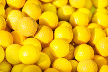 Pile of yellow golf balls  clipart