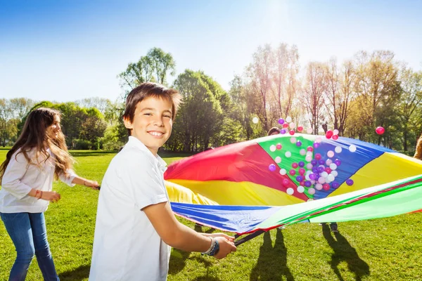 Happy kids with parachute — Stock Photo, Image