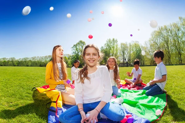 Happy kids on colorful mat — Stock Photo, Image