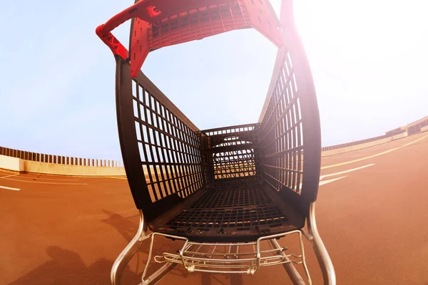 Empty plastic shopping cart — Stock Photo, Image