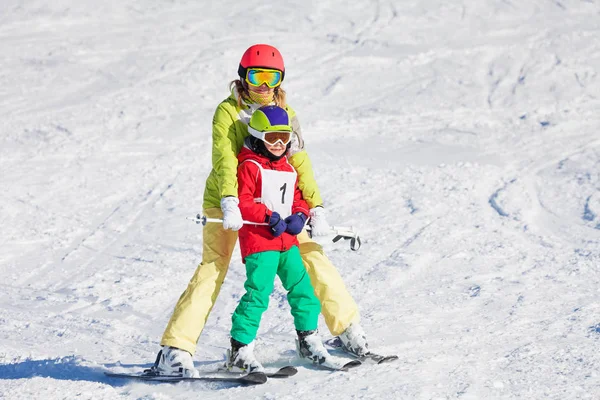Boy learning skiing with instructor Stock Picture
