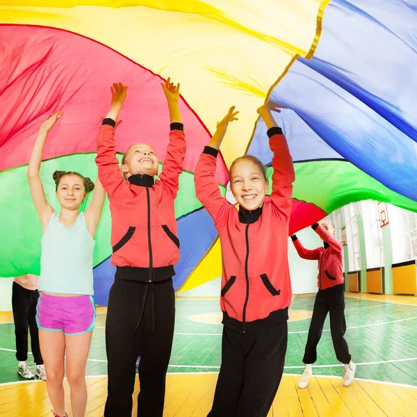 Girls playing parachute games — Stock Photo, Image