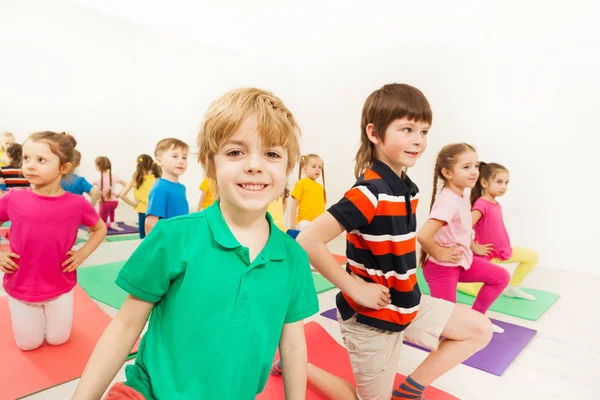 Happy kids practicing gymnastic — Stock Photo, Image