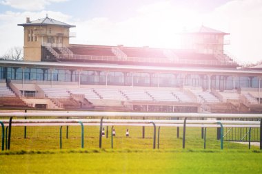 Stands building with racecourse of horse training centre at Chantilly, France clipart