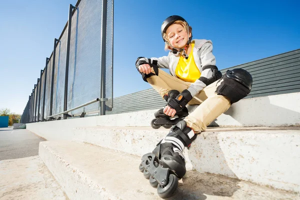 Smiling Blond Boy Roller Blades Sitting Stairs Skate Park Sunny — Stock Photo, Image