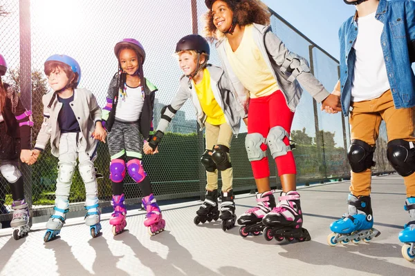 Group Multiethnic Children Happy Line Skaters Protective Gear Standing Row — Stock Photo, Image