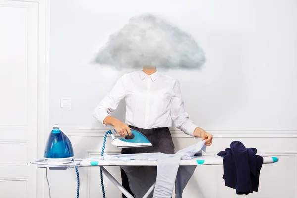 Woman ironing dress shirt with head of vapor cloud — Stock Photo, Image