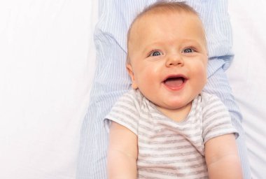 Baby laugh portrait close-up with beautiful eyes