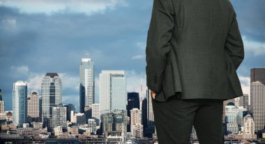 Businessman stand near window in Seattle, WA, USA