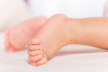 Feet and toes close-up of newborn infant baby boy
