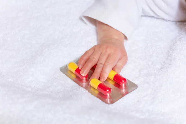 Pills drug pack in the hand of little infant baby — Stockfoto