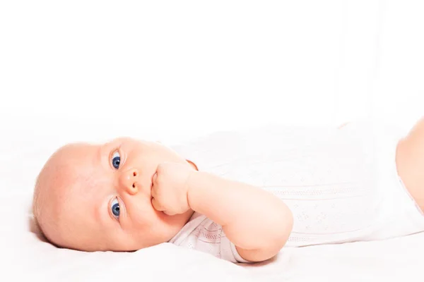 Portrait of baby infant boy with hand in the mouth — Stockfoto